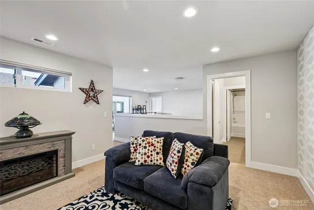 a view of living room and bedroom with furniture