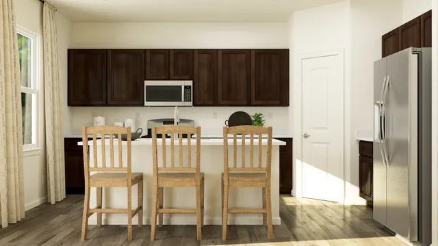 a kitchen with cabinets and refrigerator