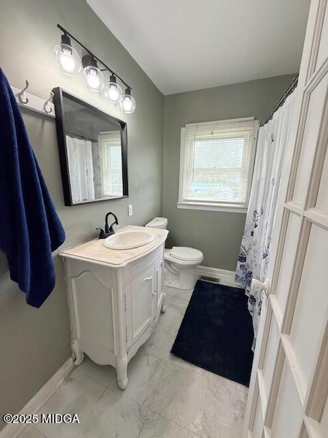 3450 Rocky Drive Macon, GA 31204 - Photo 10 of 14 a bathroom with a sink a toilet and a mirror