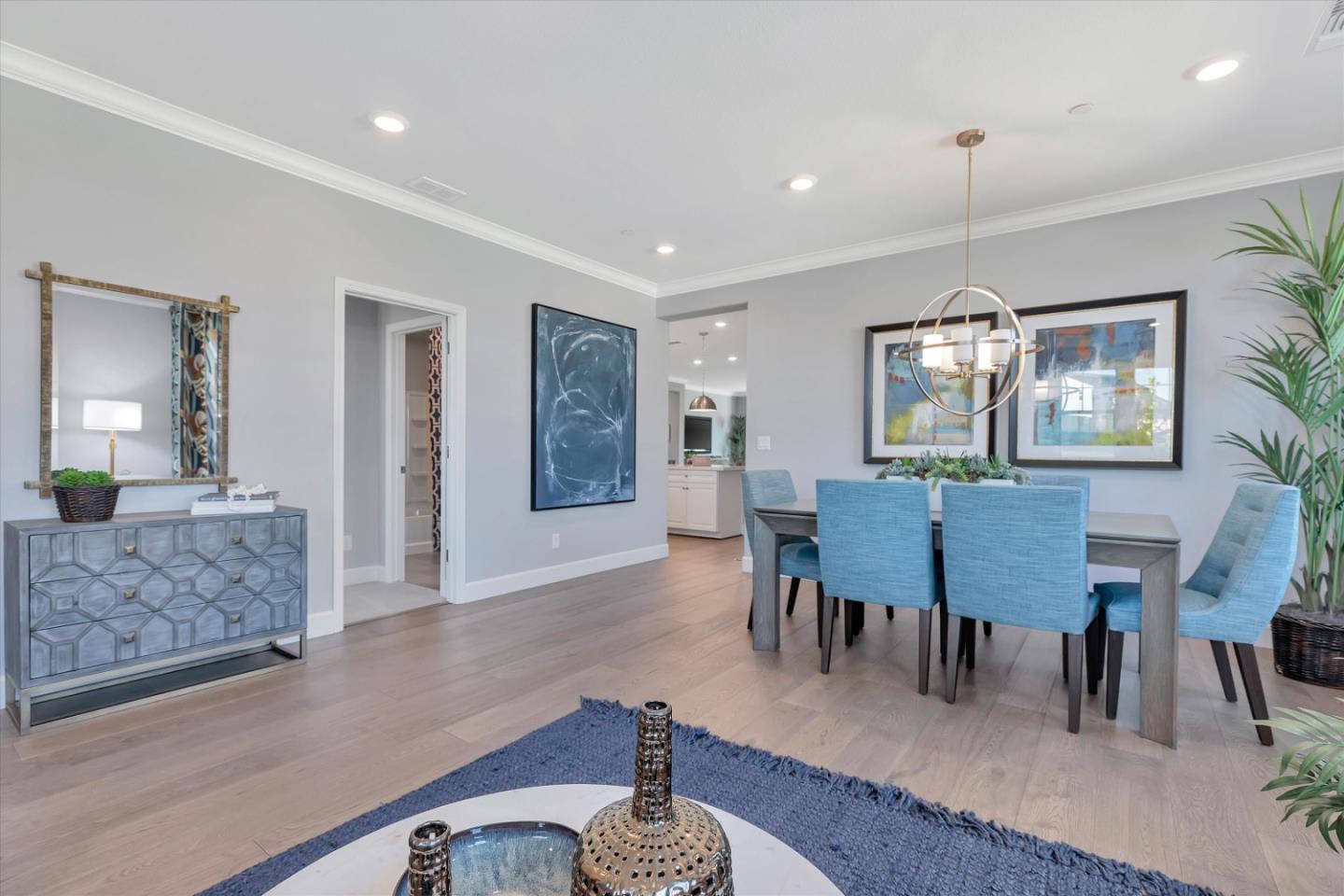 2740 Glenview Drive Hollister, CA 95023 - Photo 13 of 62 a dining room with furniture a chandelier and wooden floor