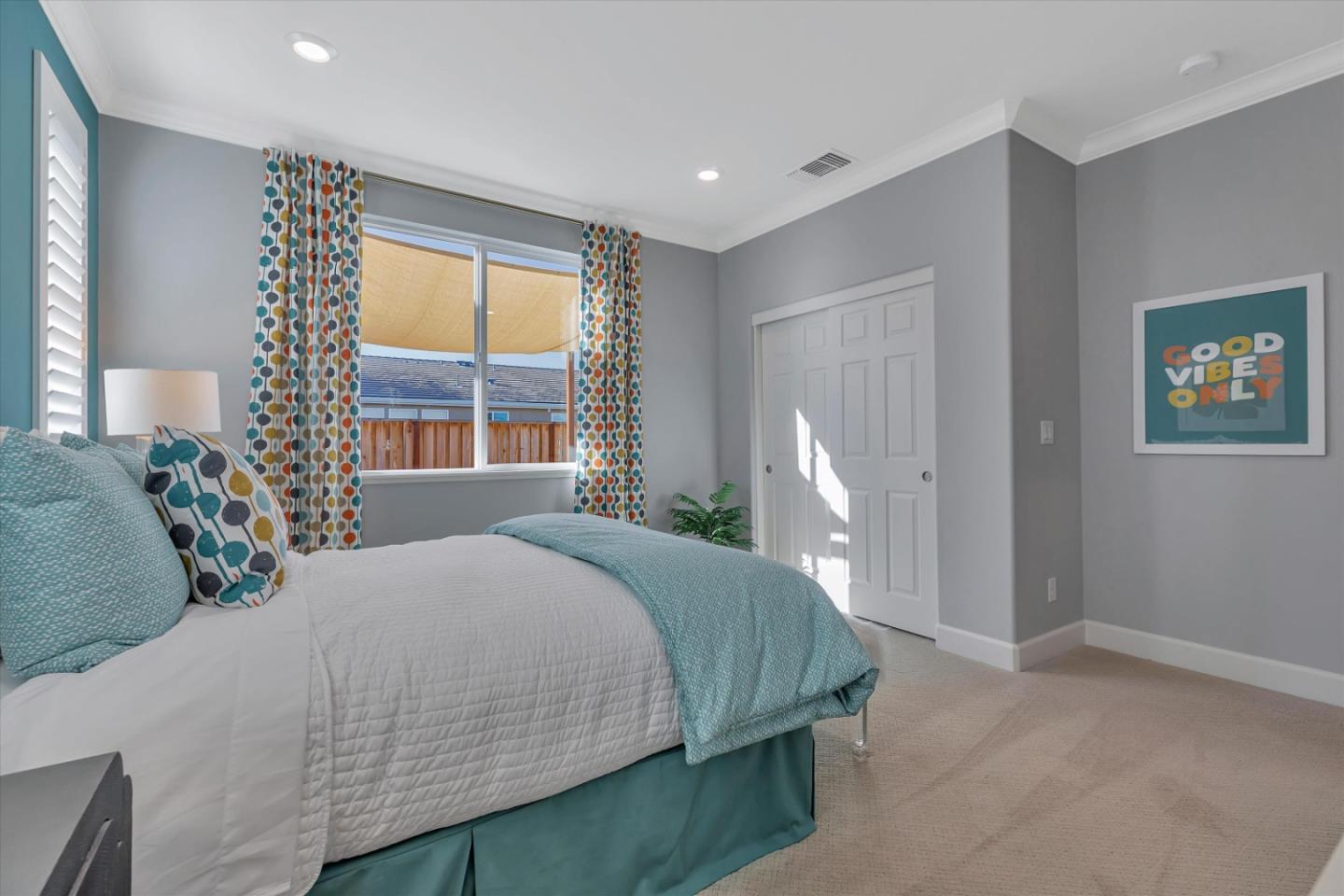 2740 Glenview Drive Hollister, CA 95023 - Photo 34 of 62 a bedroom with a bed lamp and a large window