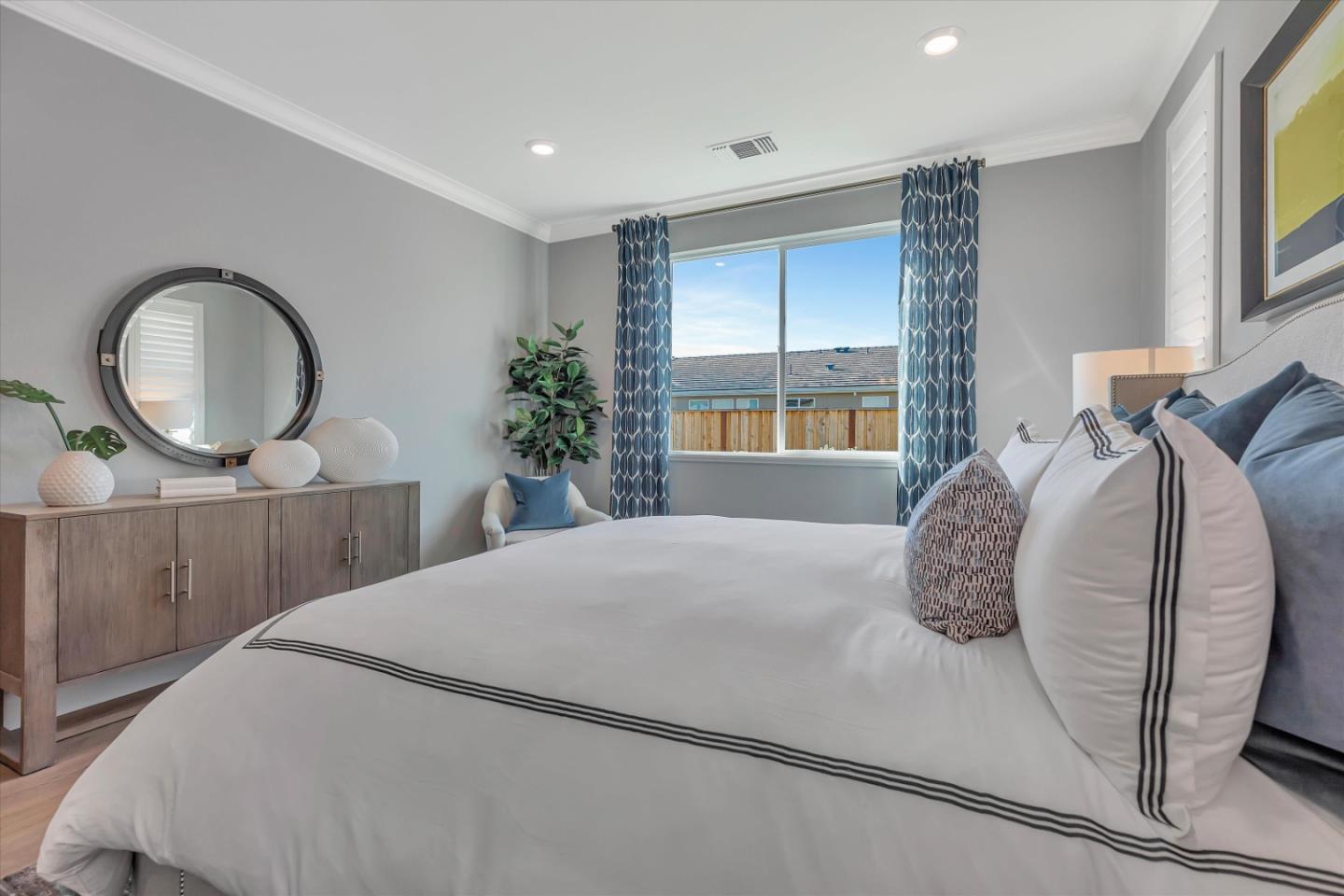 2740 Glenview Drive Hollister, CA 95023 - Photo 36 of 62 a bedroom with a bed a mirror and a large window