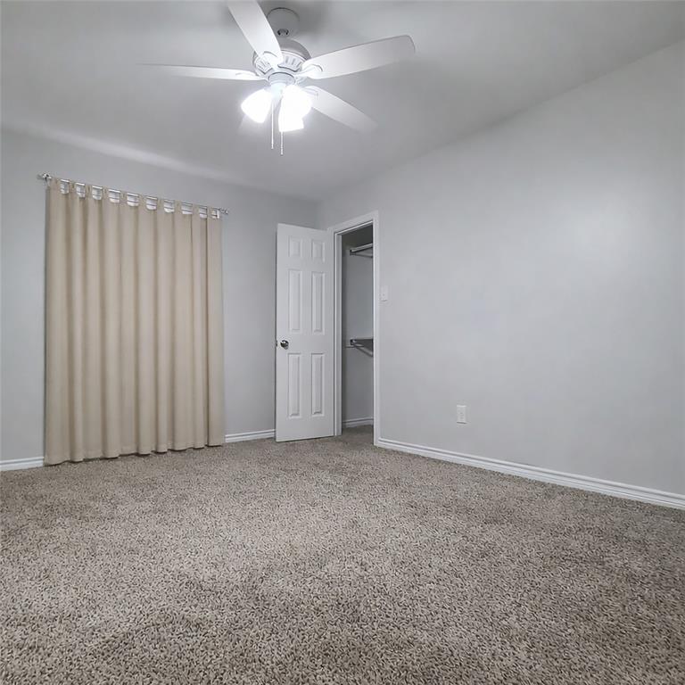 406 Epps Road Palmer, TX 75152 - Photo 32 of 40 Bedroom 4 (West Wing)West Wing - Ceiling fan and walk-in closet.