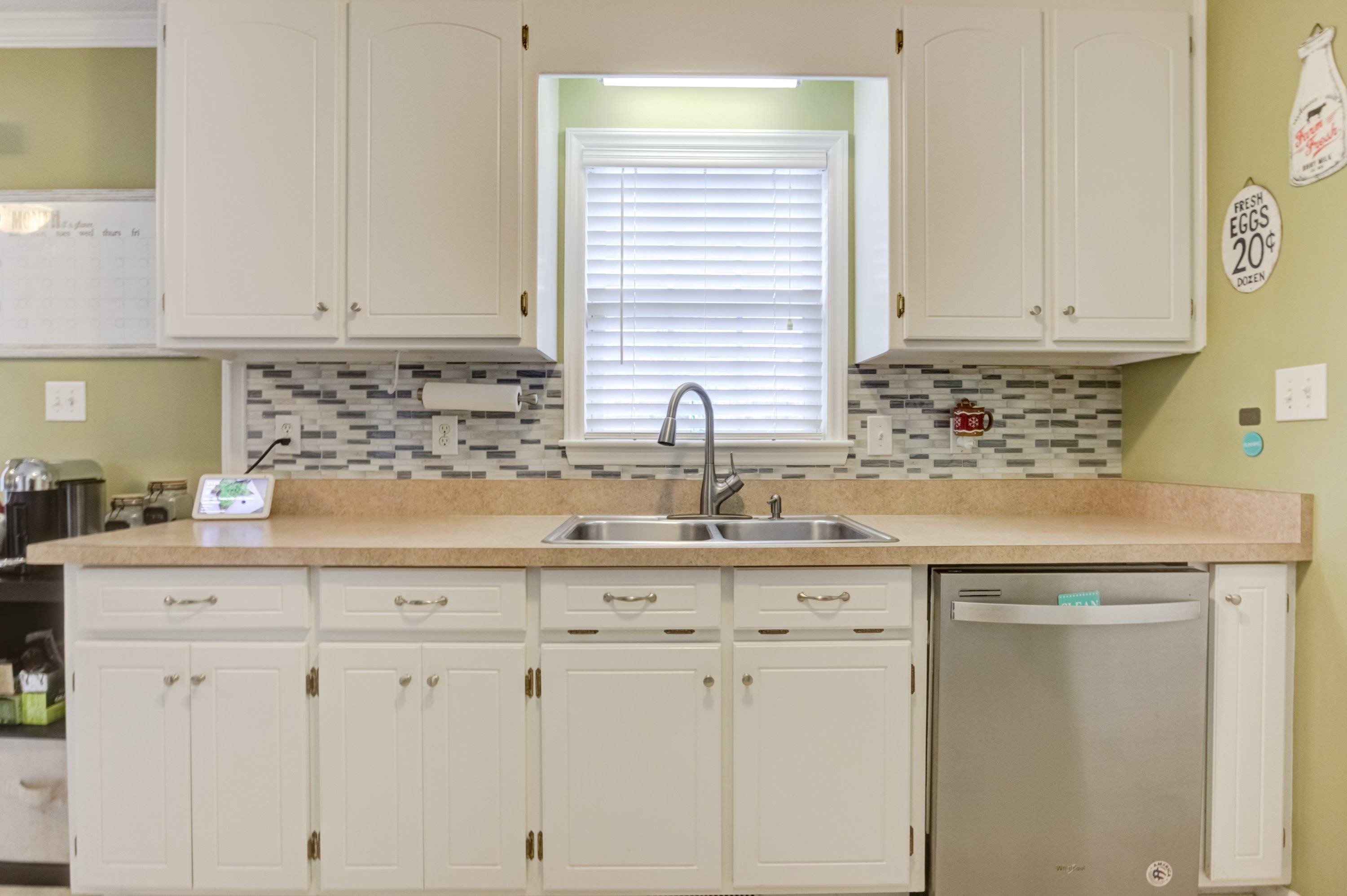 4245 Bizzell Grove Church Road Princeton, NC 27569 - Photo 11 of 30 a kitchen with white cabinets and sink