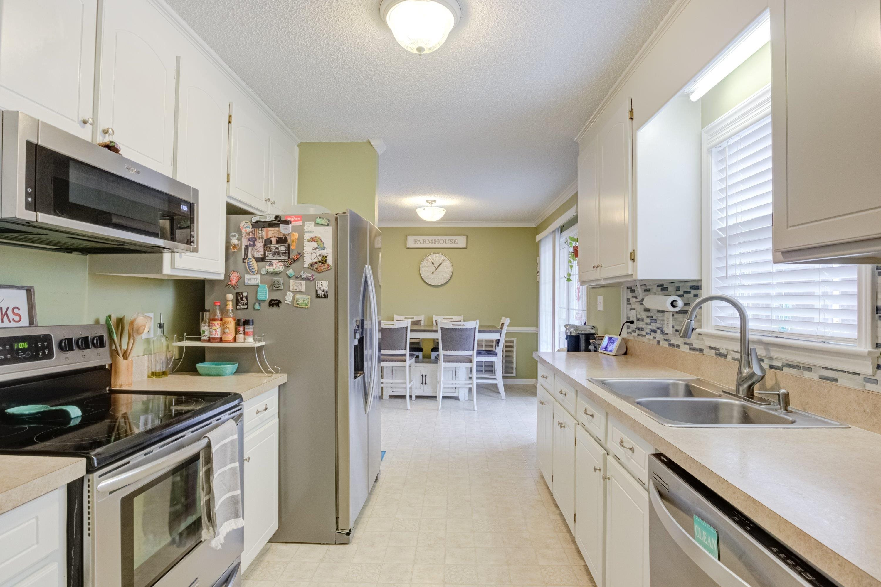 4245 Bizzell Grove Church Road Princeton, NC 27569 - Photo 12 of 30 a kitchen with stainless steel appliances granite countertop a sink stove and refrigerator