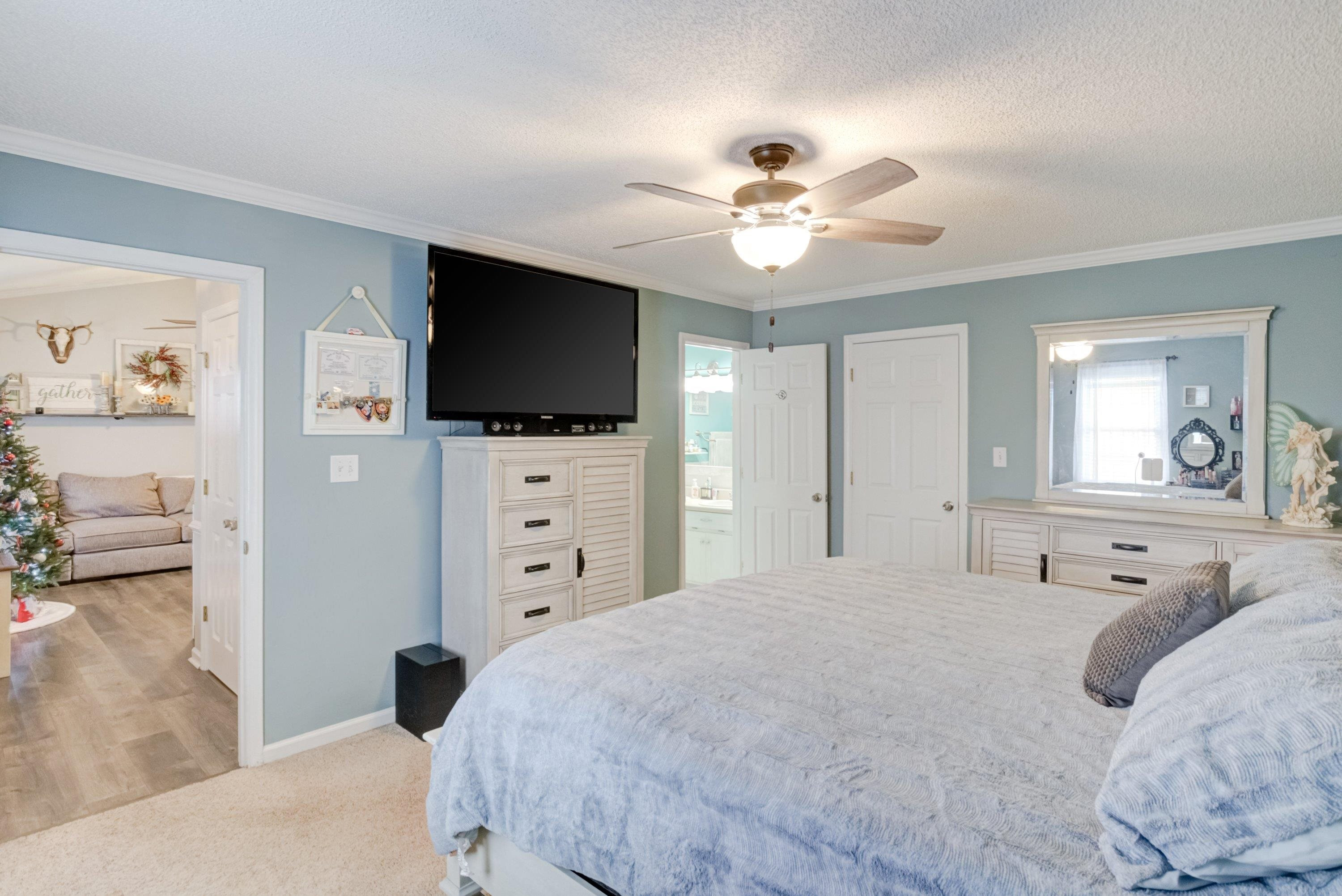 4245 Bizzell Grove Church Road Princeton, NC 27569 - Photo 16 of 30 a bedroom with a large bed and a flat screen tv