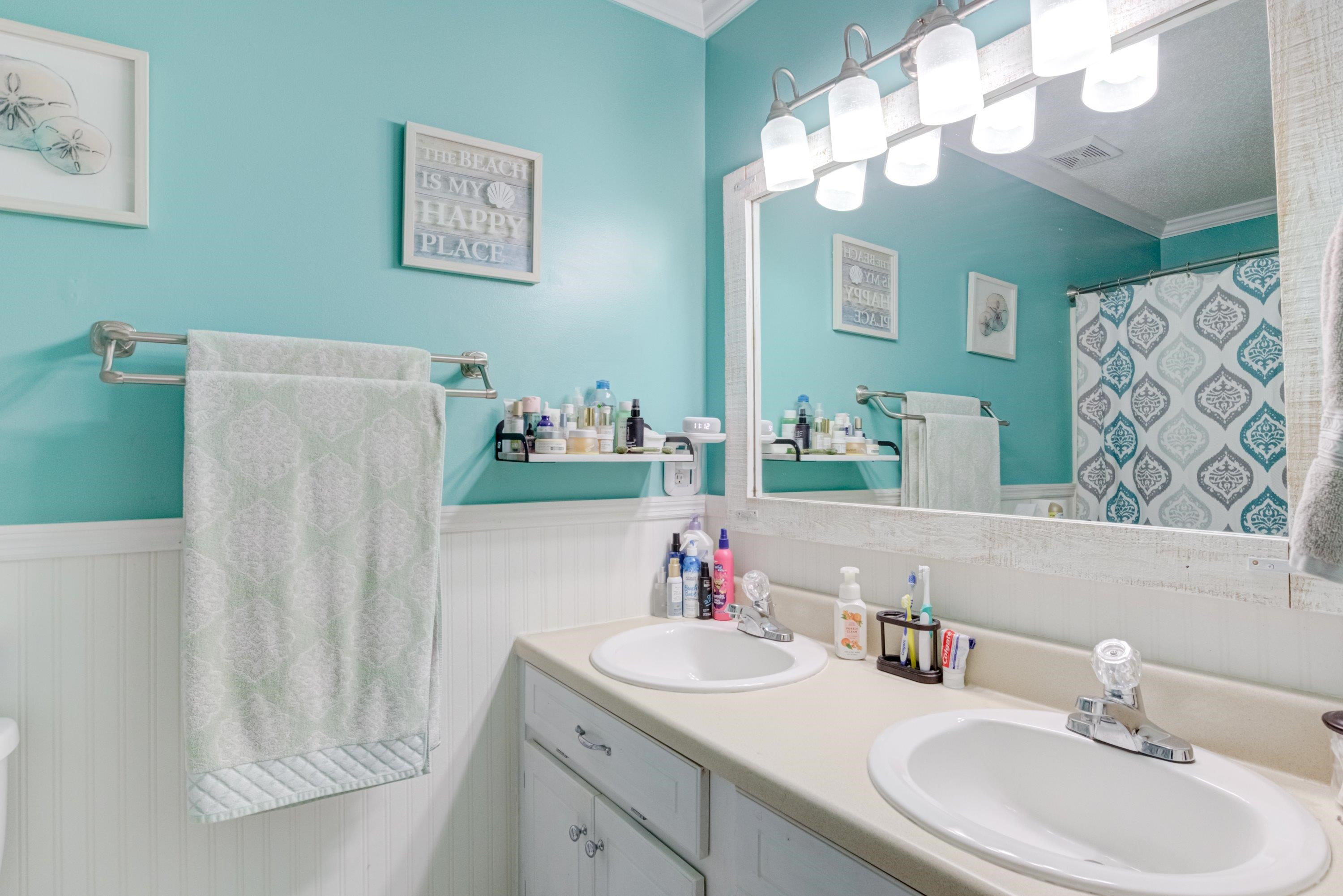 4245 Bizzell Grove Church Road Princeton, NC 27569 - Photo 19 of 30 a bathroom with a sink vanity and a mirror