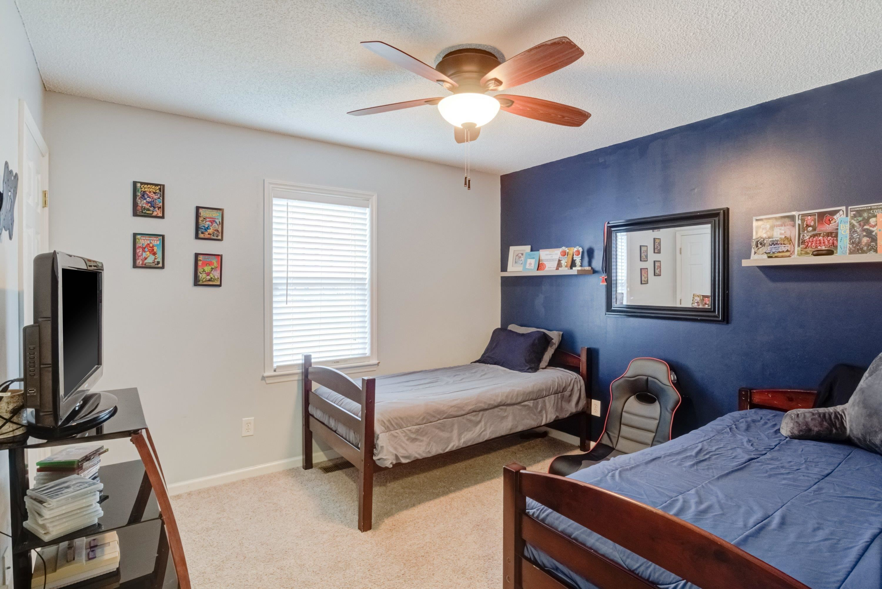 4245 Bizzell Grove Church Road Princeton, NC 27569 - Photo 21 of 30 a bedroom with bed and a flat screen tv