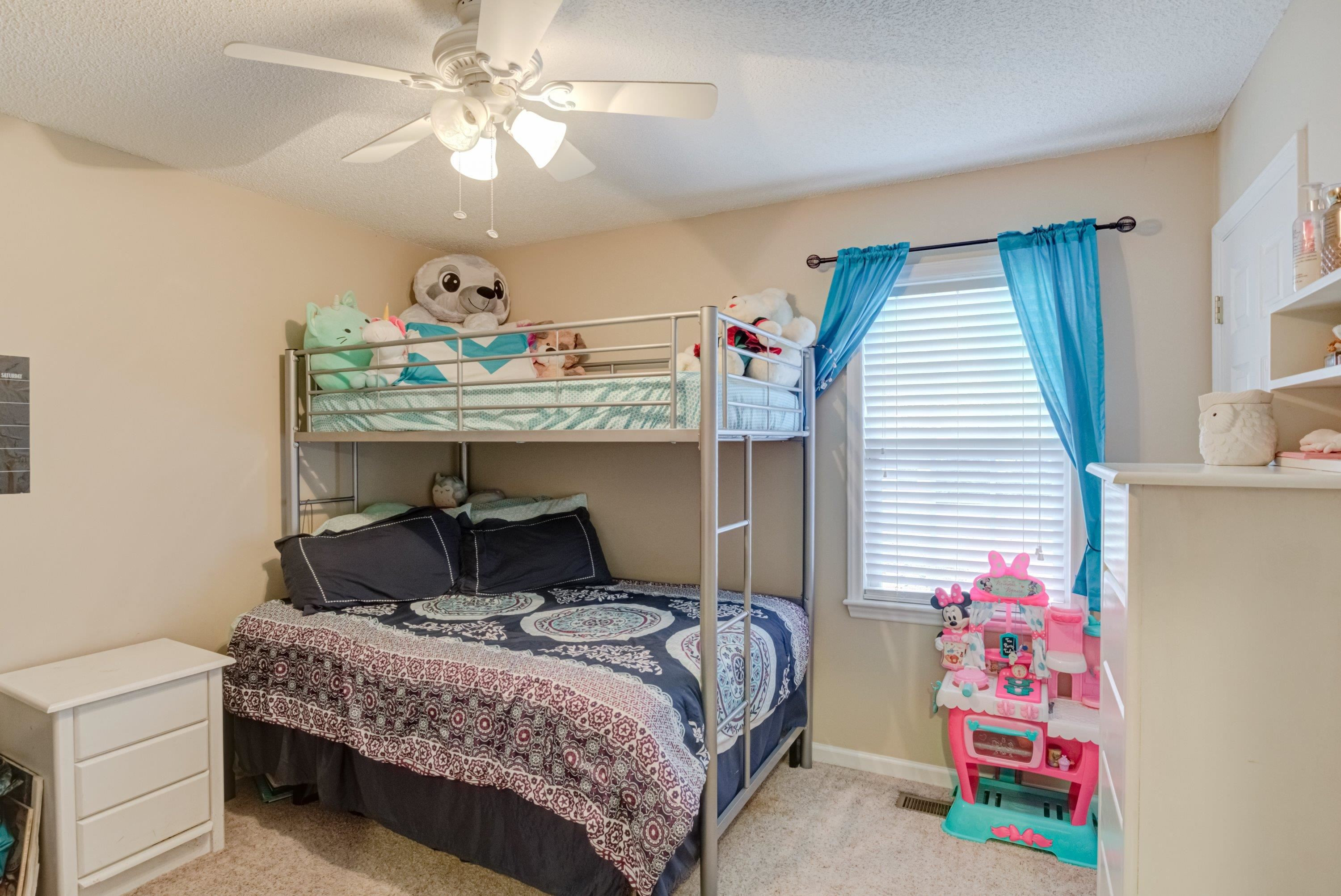 4245 Bizzell Grove Church Road Princeton, NC 27569 - Photo 24 of 30 a bedroom with a bed and a dresser
