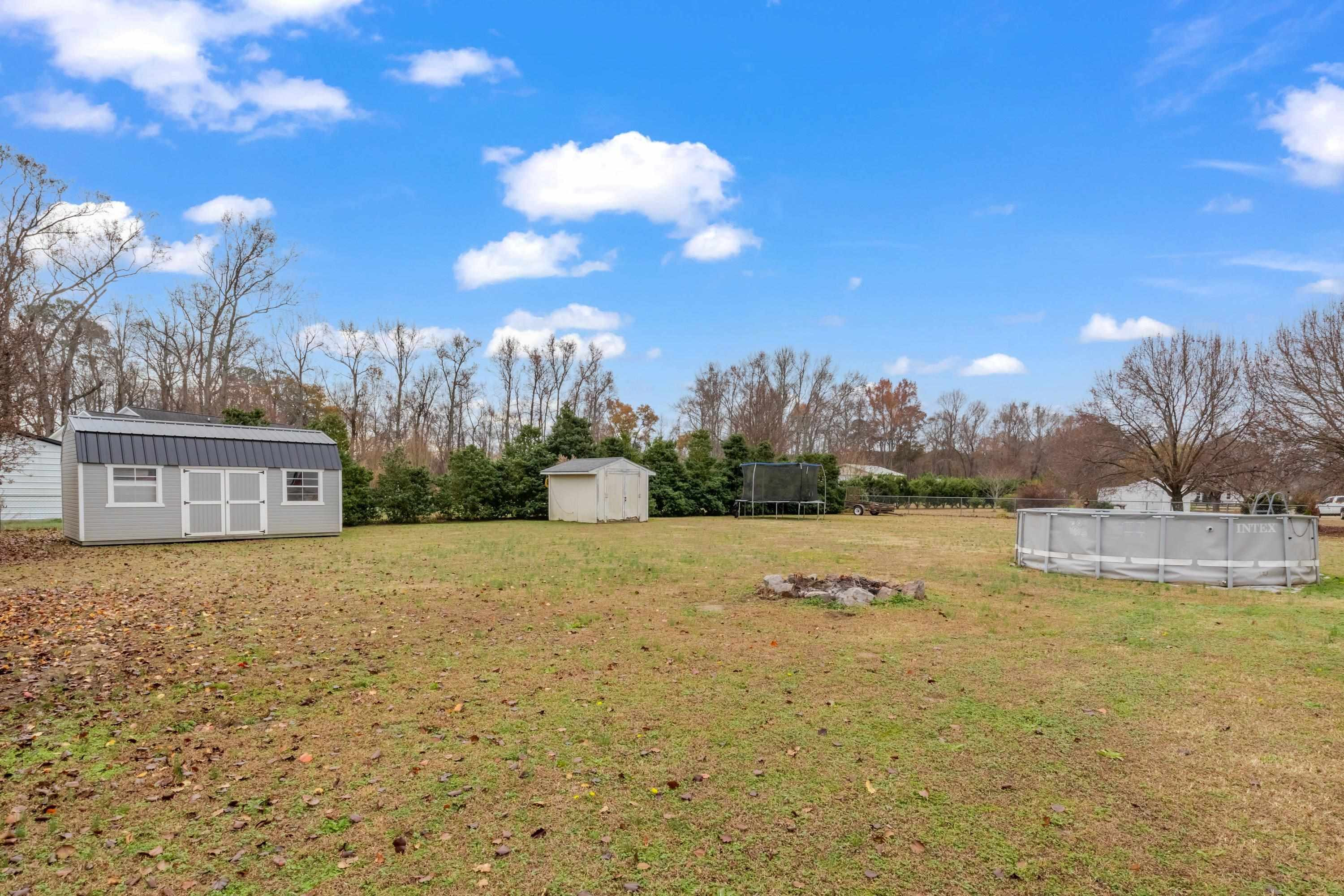 4245 Bizzell Grove Church Road Princeton, NC 27569 - Photo 29 of 30 a view of a house with a yard and lake view