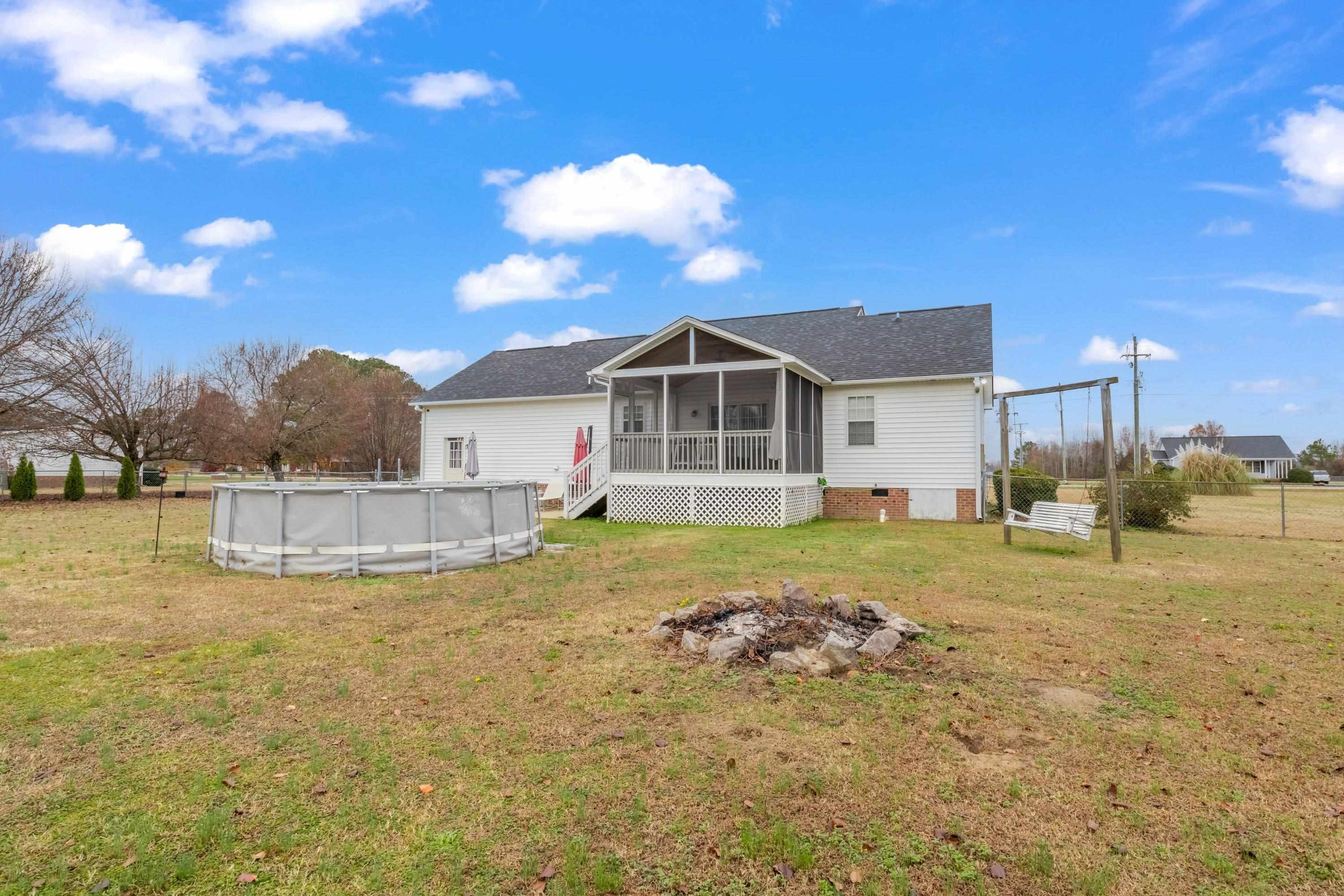 4245 Bizzell Grove Church Road Princeton, NC 27569 - Photo 30 of 30 a view of a house with a yard