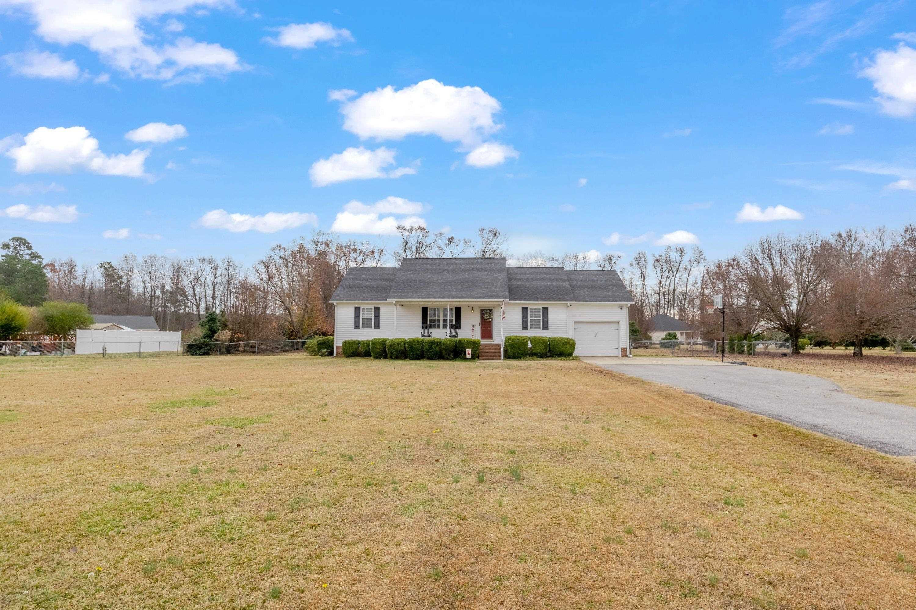 4245 Bizzell Grove Church Road Princeton, NC 27569 - Photo 3 of 30 a view of a house with a yard