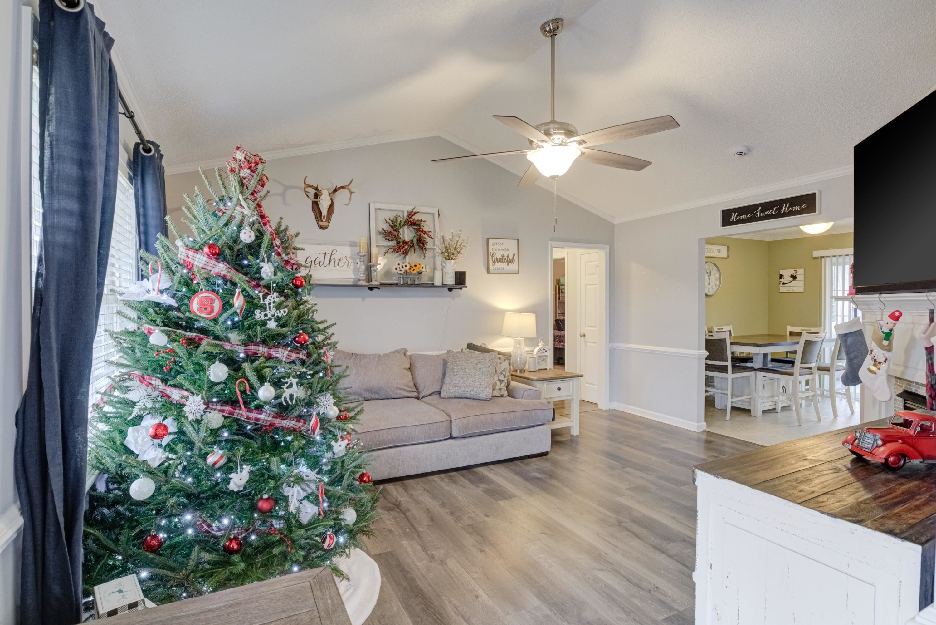 4245 Bizzell Grove Church Road Princeton, NC 27569 - Photo 6 of 30 a living room with furniture and a flat screen tv