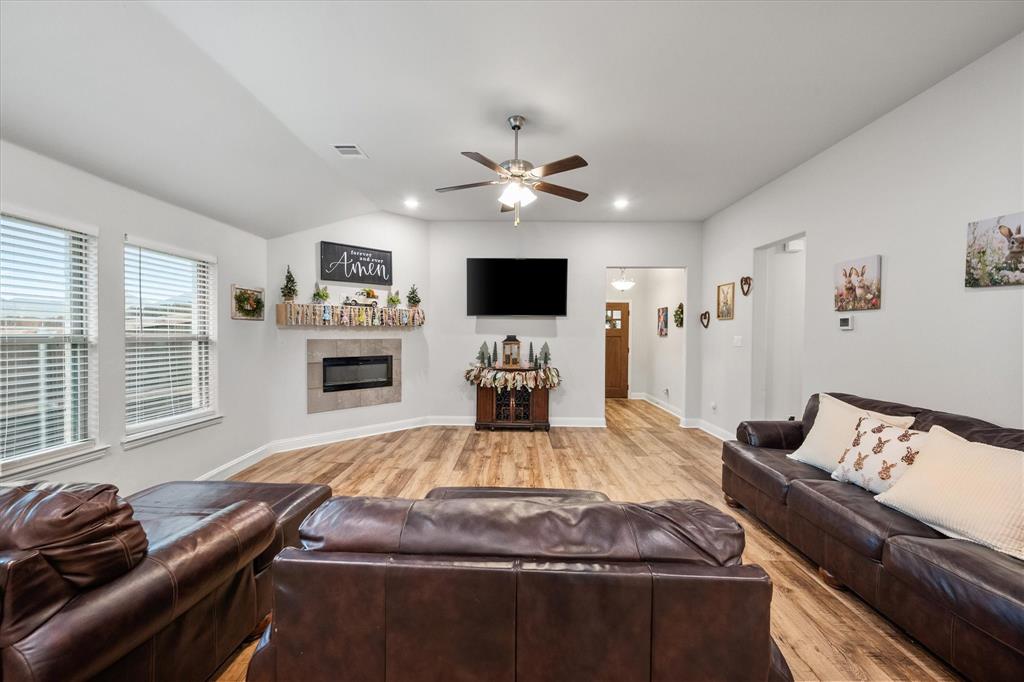 103 Randal Row Corsicana, TX 75110 - Photo 7 of 35 a living room with furniture fireplace and flat screen tv