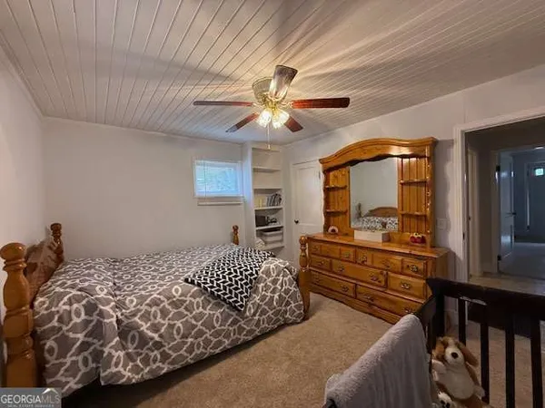 a bedroom with furniture and a chandelier