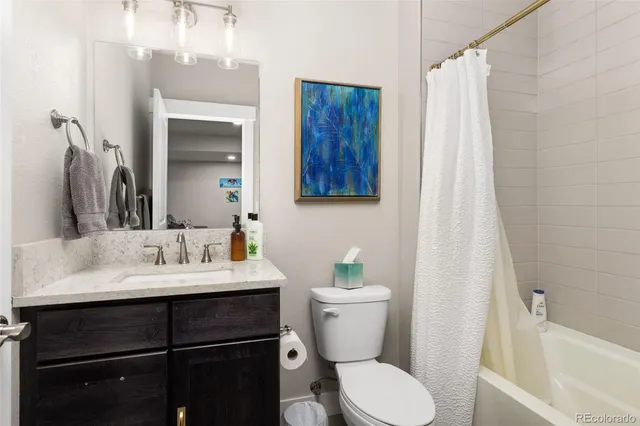 a bedroom with a bed and a mirror