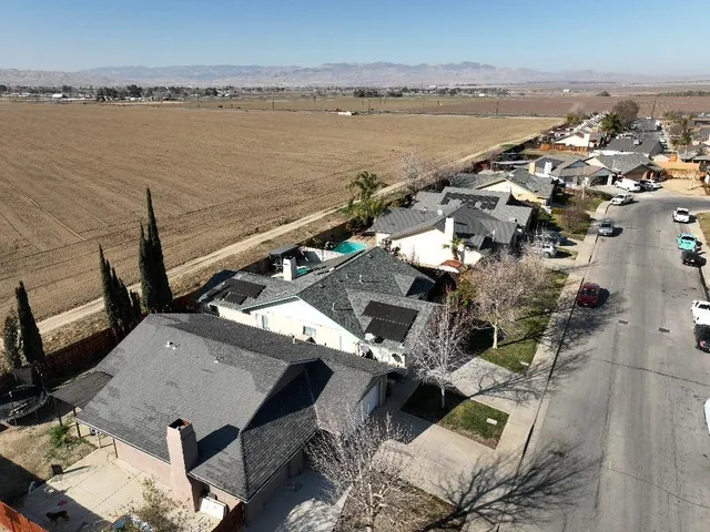 an aerial view of a city with ocean view