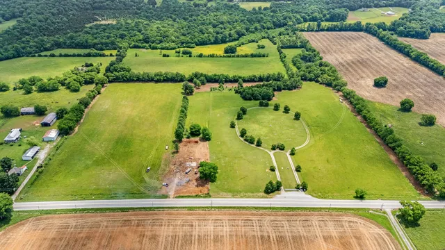 an aerial view of a residential houses with outdoor space