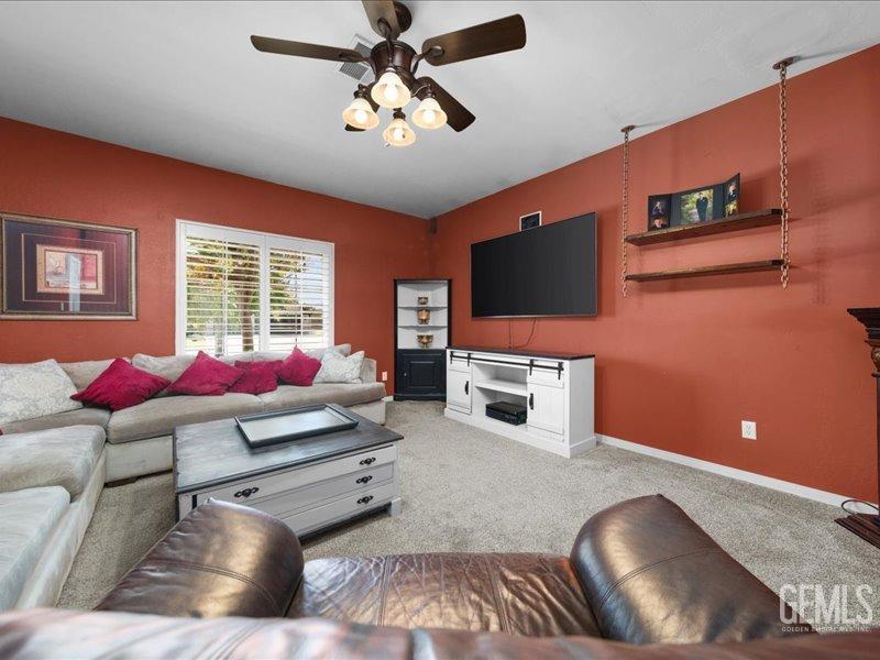 Undisclosed Address Bakersfield, CA 93314 - Photo 17 of 38 a living room with furniture and a flat screen tv