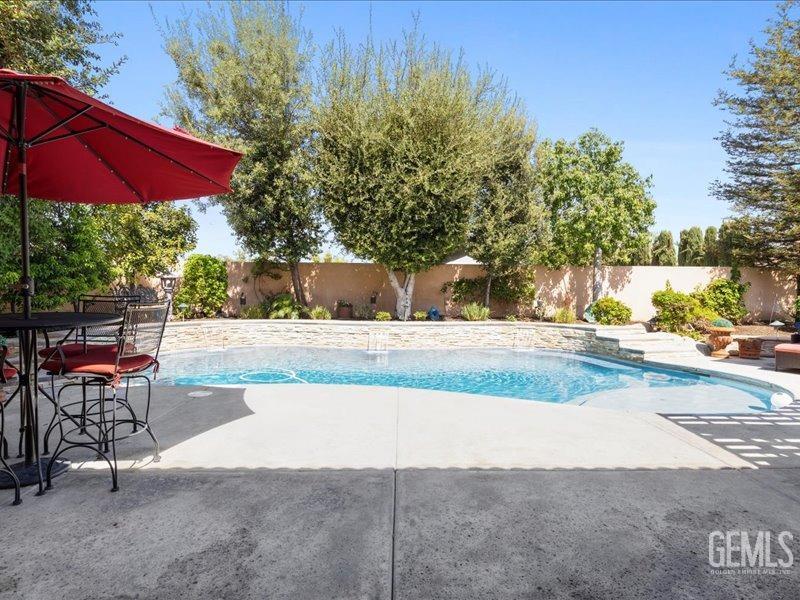 Undisclosed Address Bakersfield, CA 93314 - Photo 30 of 38 a view of a swimming pool with a patio
