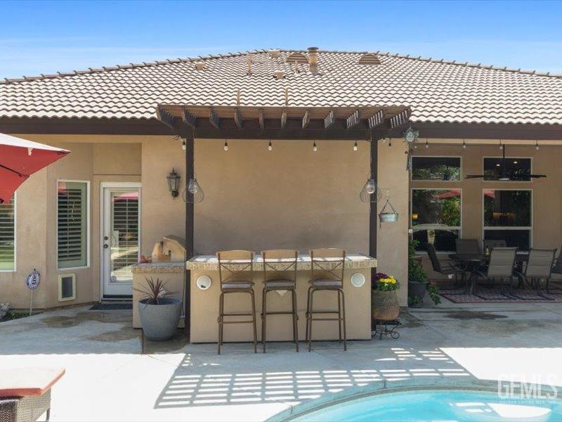 Undisclosed Address Bakersfield, CA 93314 - Photo 33 of 38 a view of a patio with table and chairs