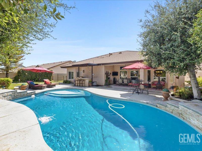 Undisclosed Address Bakersfield, CA 93314 - Photo 35 of 38 a view of a house with swimming pool and sitting area