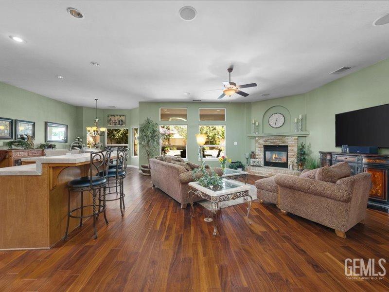 Undisclosed Address Bakersfield, CA 93314 - Photo 6 of 38 a living room with fireplace furniture and a flat screen tv