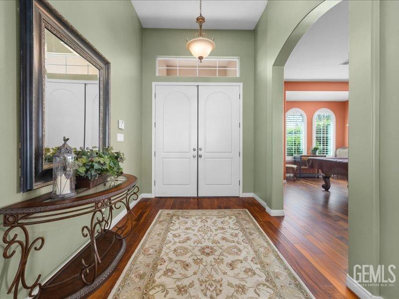 Undisclosed Address Bakersfield, CA 93314 - Photo 7 of 38 a living room with a bed and a chandelier