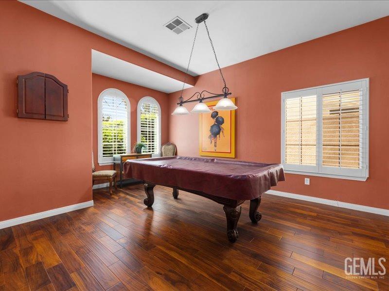 Undisclosed Address Bakersfield, CA 93314 - Photo 8 of 38 a living room with furniture a window and wooden floor