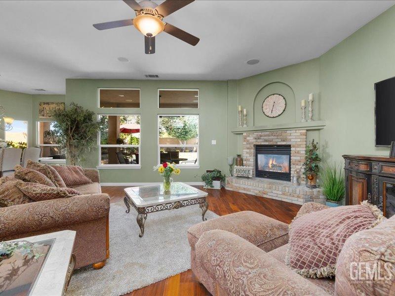 Undisclosed Address Bakersfield, CA 93314 - Photo 10 of 38 a living room with furniture and a fireplace
