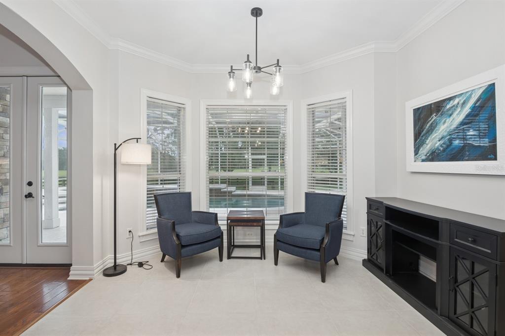 35520 Timbertop Lane Fruitland Park, FL 34731 - Photo 14 of 82 a living room with furniture and a chandelier