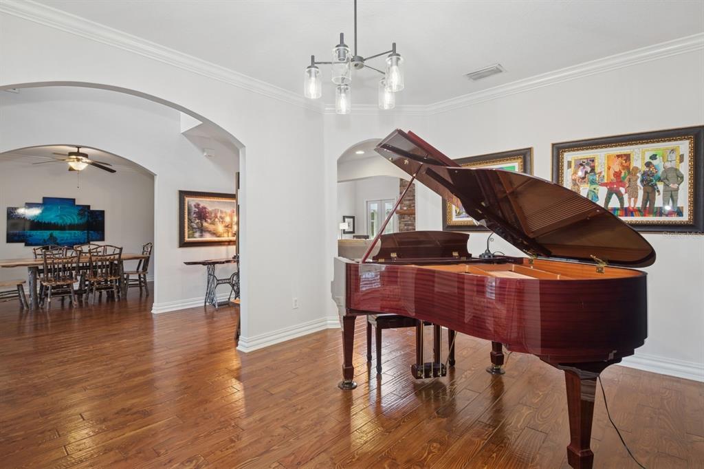 35520 Timbertop Lane Fruitland Park, FL 34731 - Photo 19 of 82 a living room with furniture and wooden floor