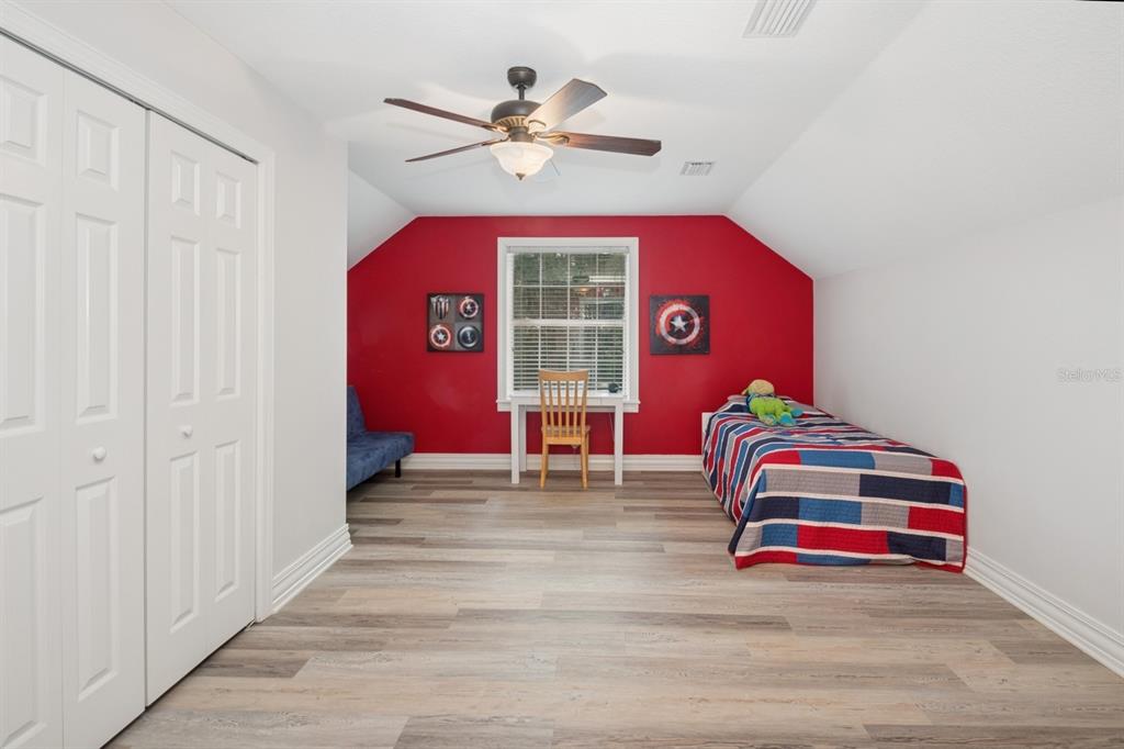 35520 Timbertop Lane Fruitland Park, FL 34731 - Photo 36 of 82 a view of a livingroom with a window and a ceiling fan