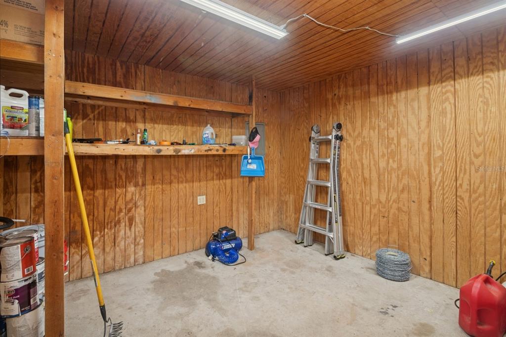35520 Timbertop Lane Fruitland Park, FL 34731 - Photo 60 of 82 a view of an empty room with wooden walls