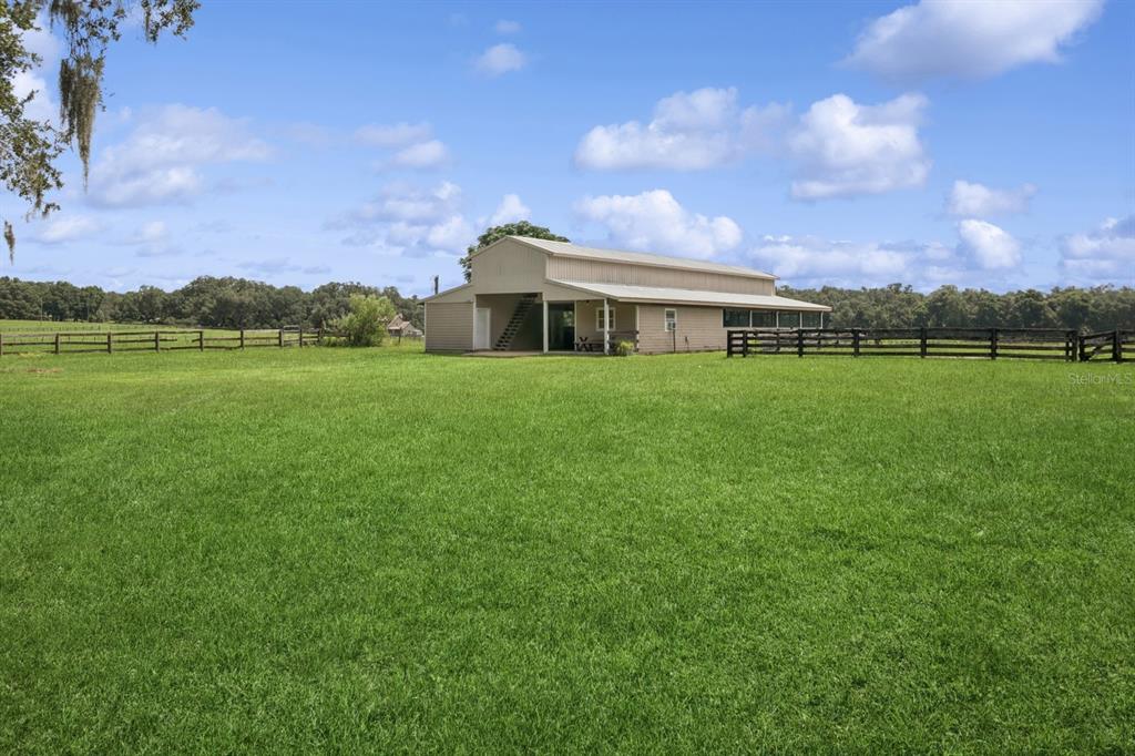 35520 Timbertop Lane Fruitland Park, FL 34731 - Photo 71 of 82 a view of a big yard with a house in the background