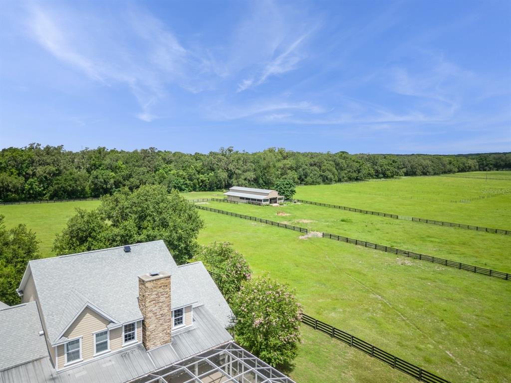 35520 Timbertop Lane Fruitland Park, FL 34731 - Photo 76 of 82 a view of a lake with a yard