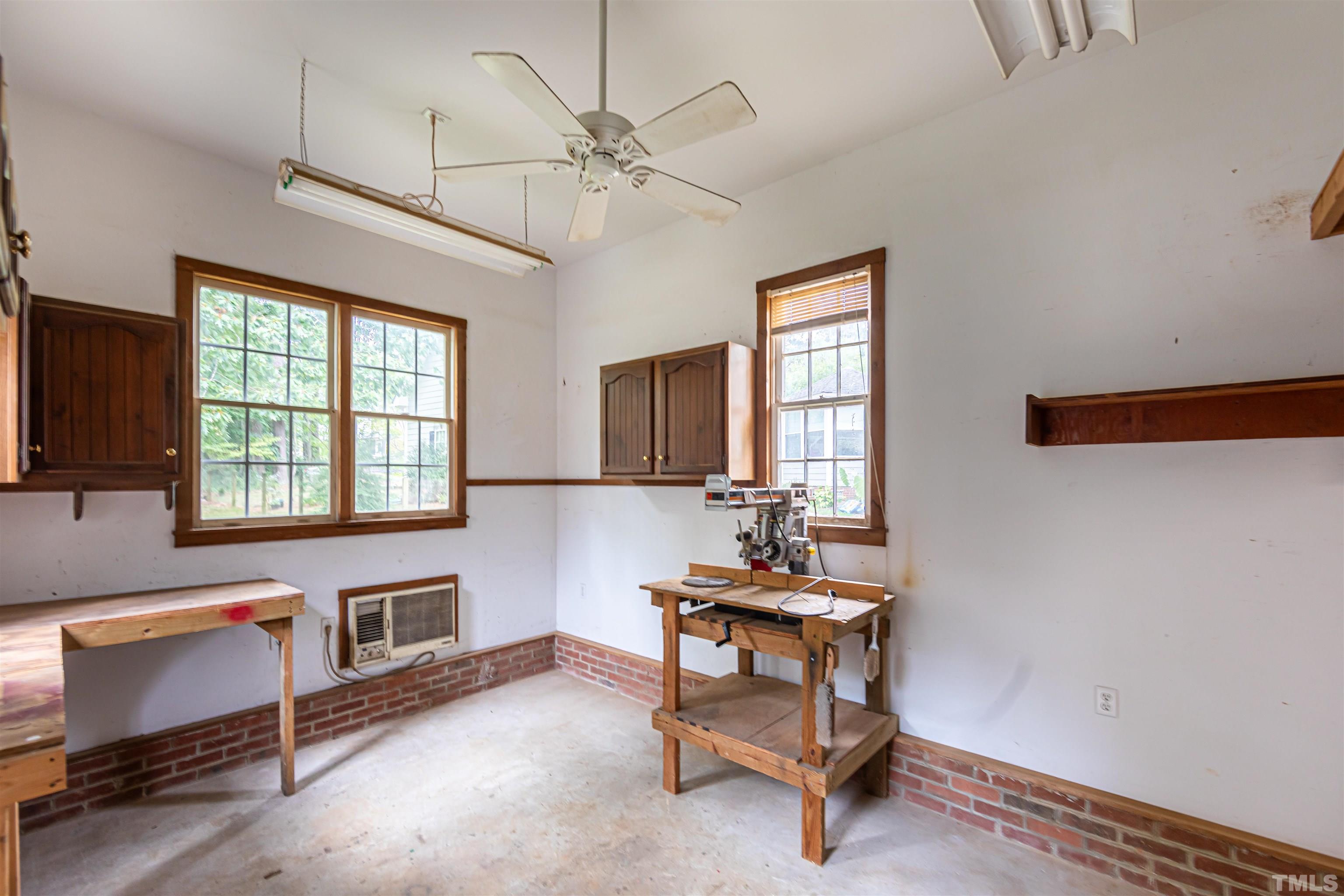 8217 Running Cedar Trail Raleigh, NC 27615 - Photo 23 of 23 a workspace with wooden floor and windows