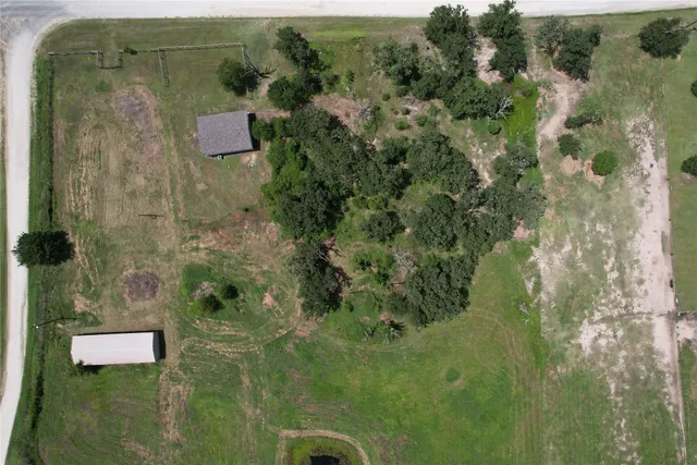 an aerial view of residential house with outdoor space