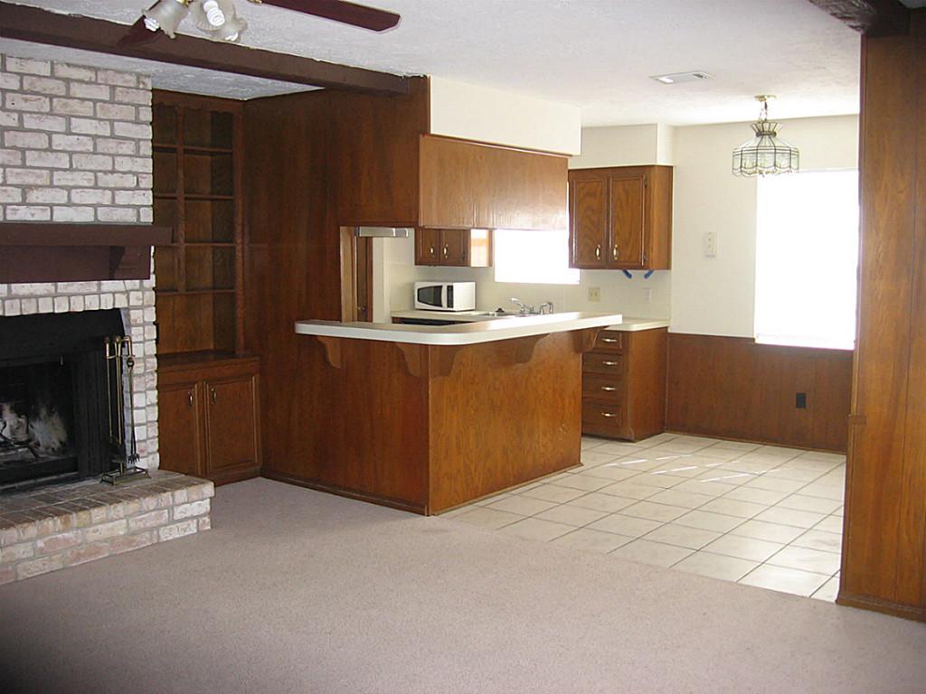 25407 Tuckahoe Lane Spring, TX 77373 - Photo 14 of 20 a kitchen with granite countertop a refrigerator and a stove
