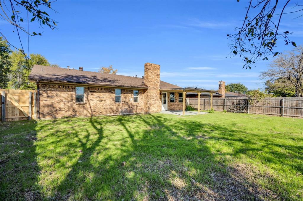 221 North Edgefield Road Waxahachie, TX 75165 - Photo 25 of 27 a front view of a house with a yard