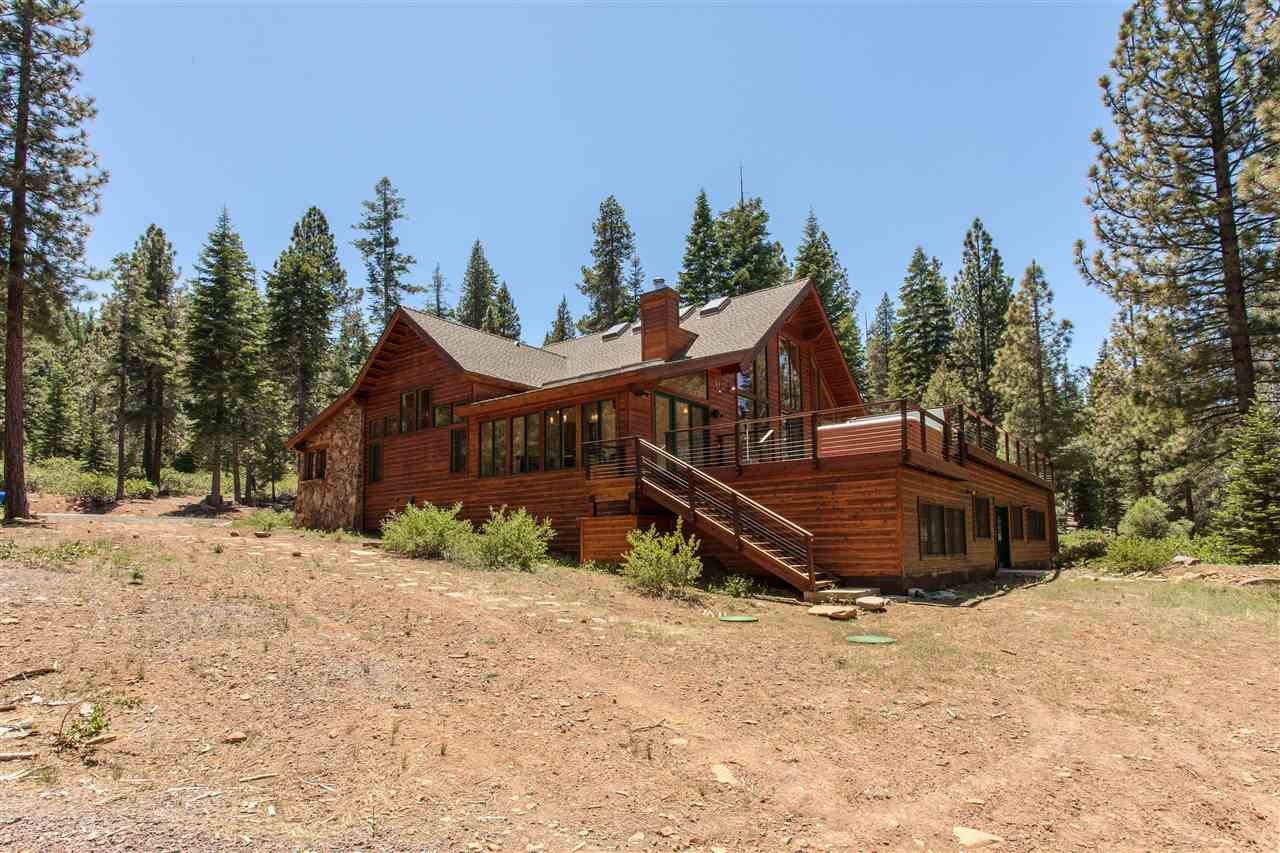12998 Timber Ridge Road Truckee, CA 96161 - Photo 19 of 20 a wooden bench sitting in middle of a yard