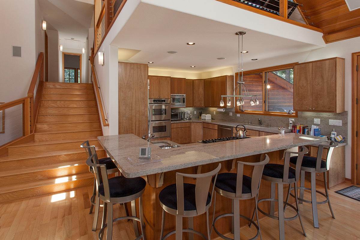 12998 Timber Ridge Road Truckee, CA 96161 - Photo 3 of 20 a large kitchen with a table and chairs