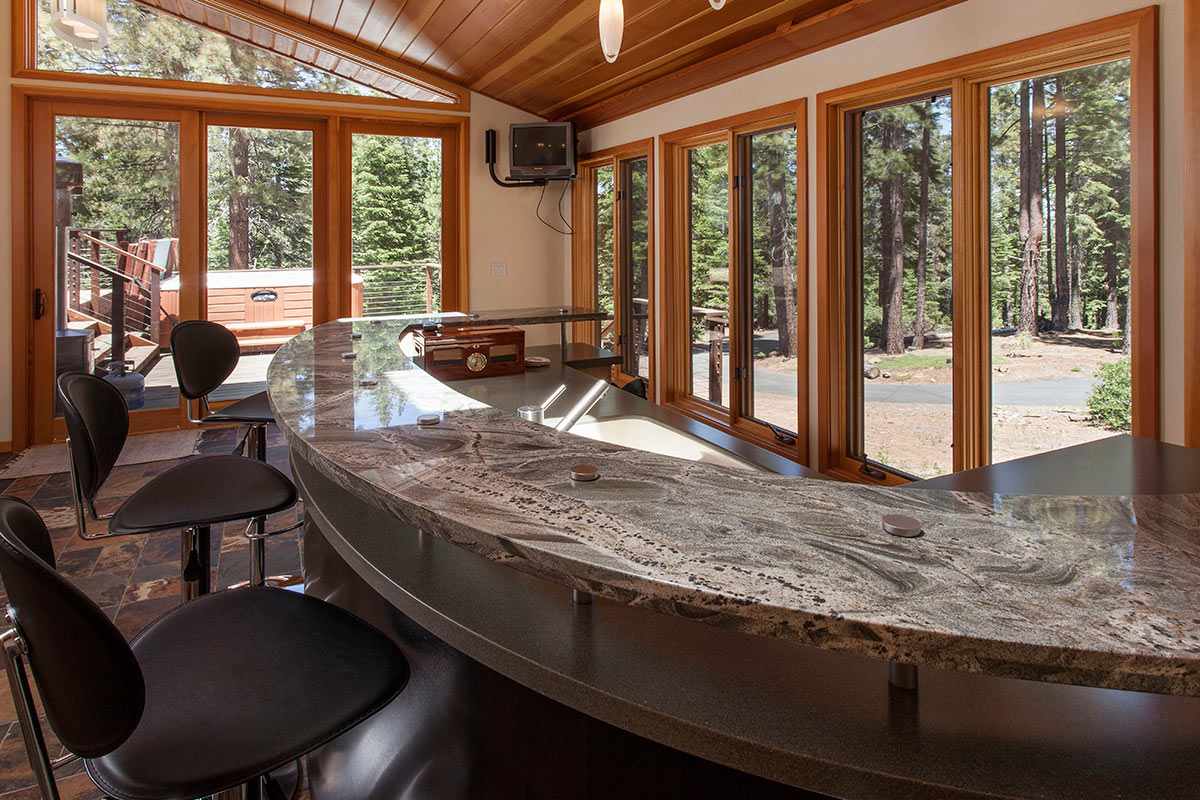 12998 Timber Ridge Road Truckee, CA 96161 - Photo 7 of 20 a view of a dining room with furniture large windows and wooden floor