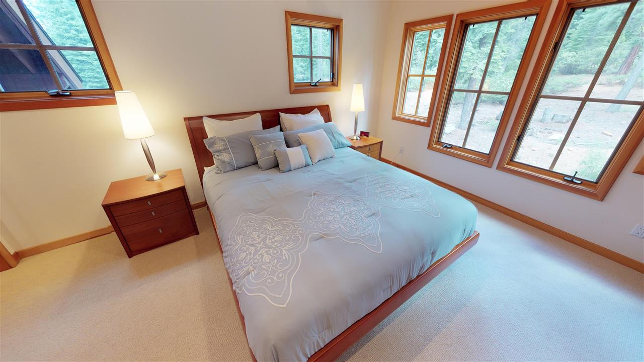 12998 Timber Ridge Road Truckee, CA 96161 - Photo 10 of 20 a bed sitting in a bedroom next to a window