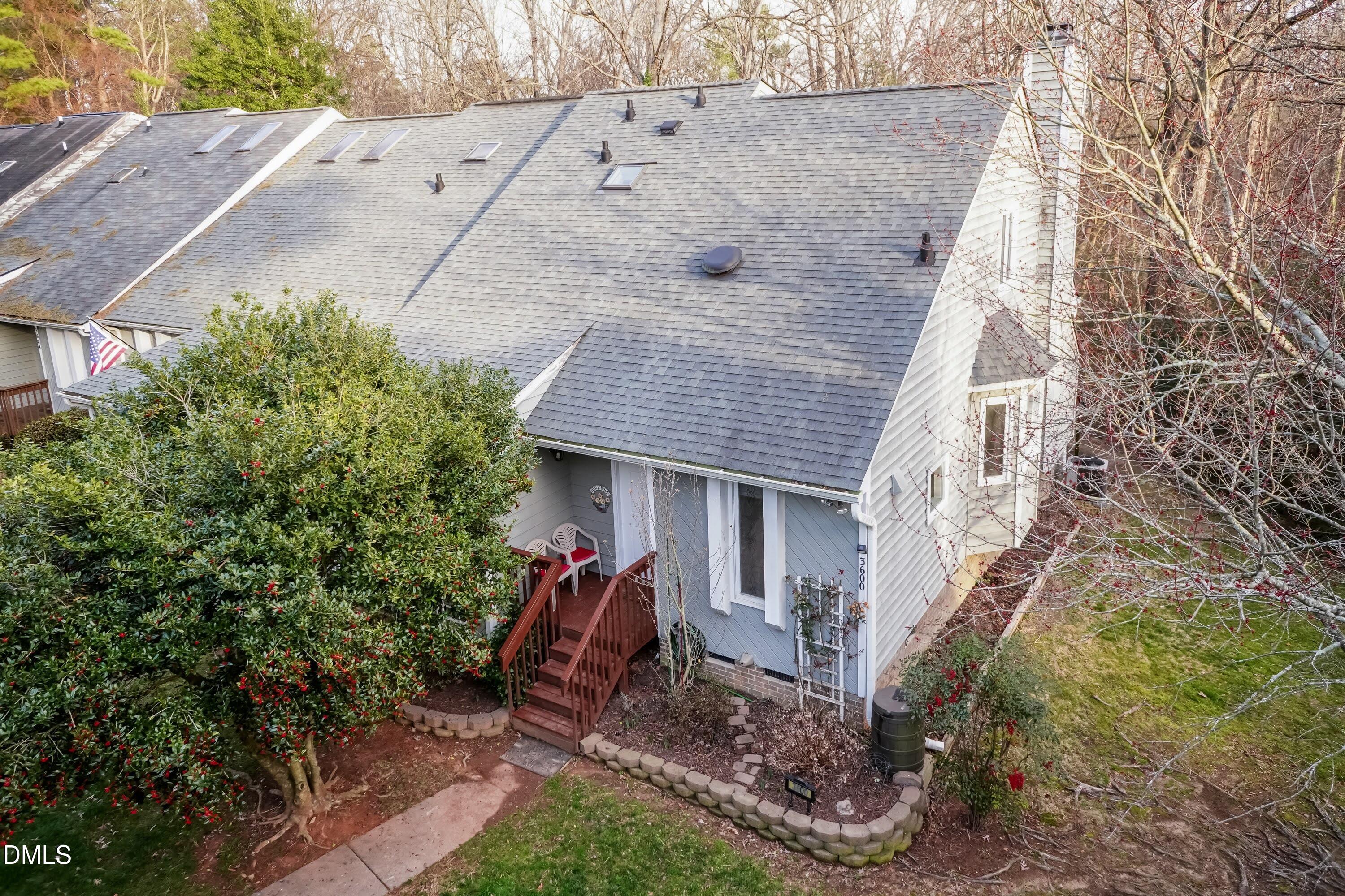 3600 Top Of The Pines Court Raleigh, NC 27604 - Photo 3 of 45 a view of a house with a small yard and large tree