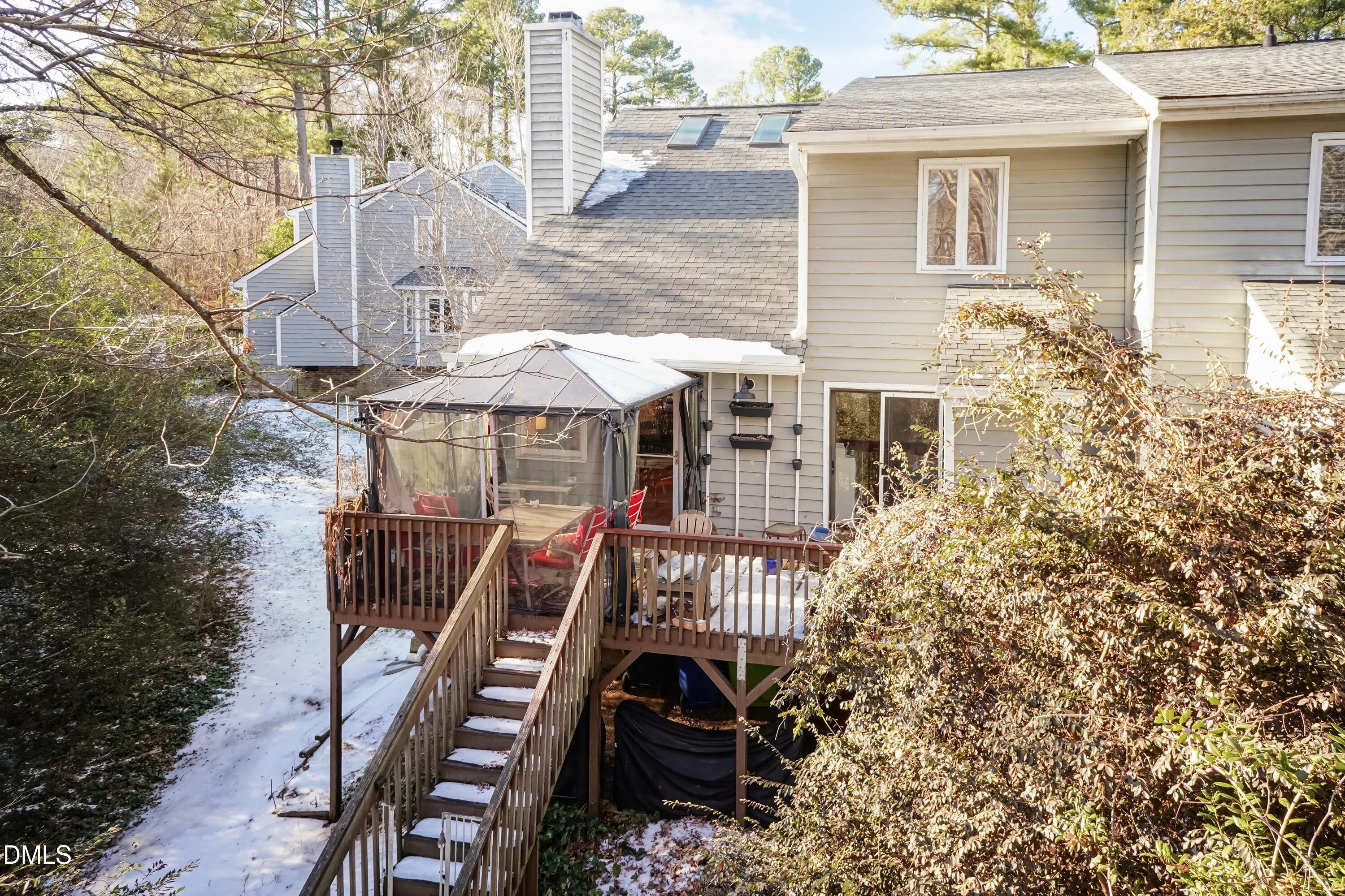3600 Top Of The Pines Court Raleigh, NC 27604 - Photo 42 of 45 a view of a patio with table and chairs and wooden fence