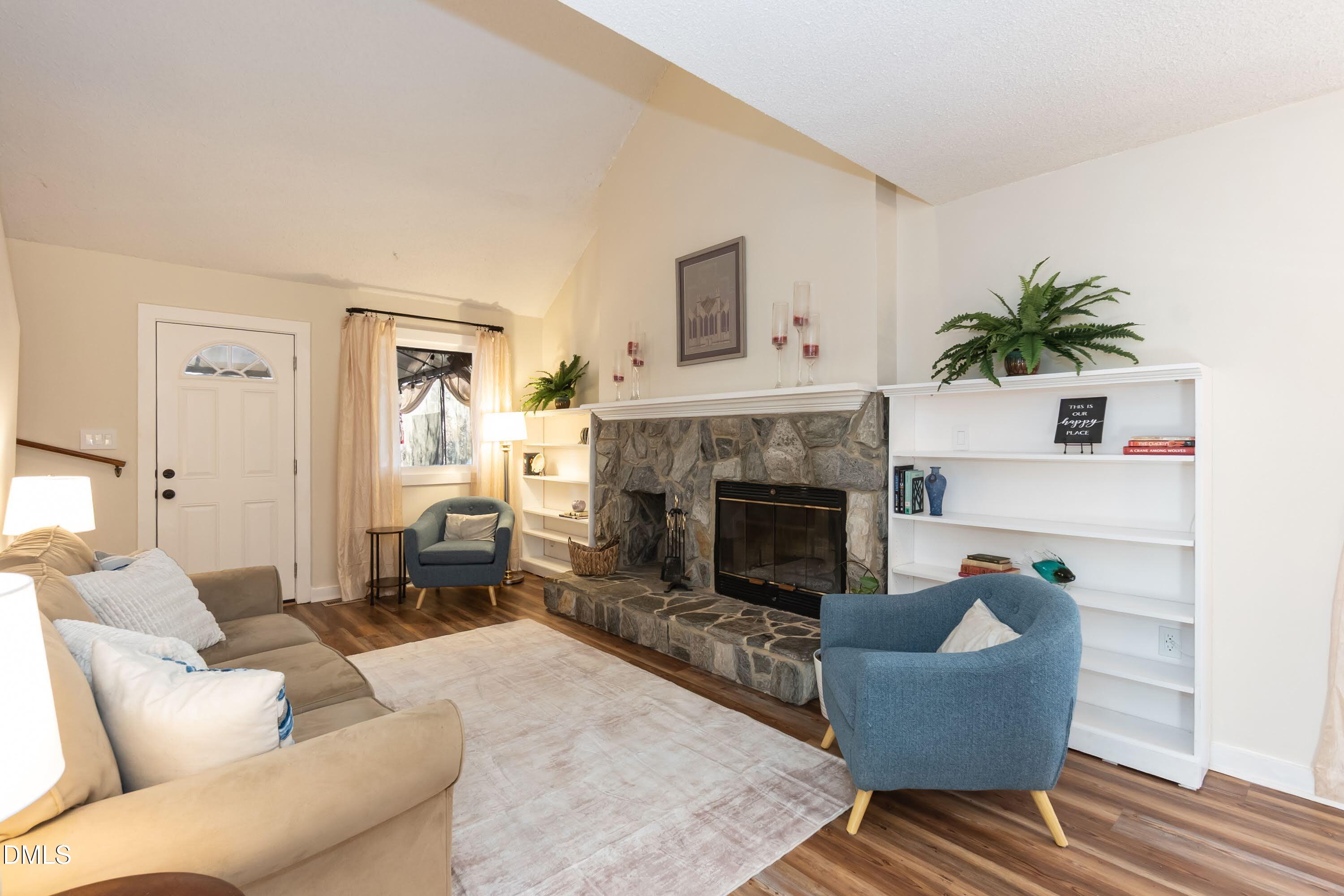 3600 Top Of The Pines Court Raleigh, NC 27604 - Photo 8 of 45 a living room with furniture and a fireplace
