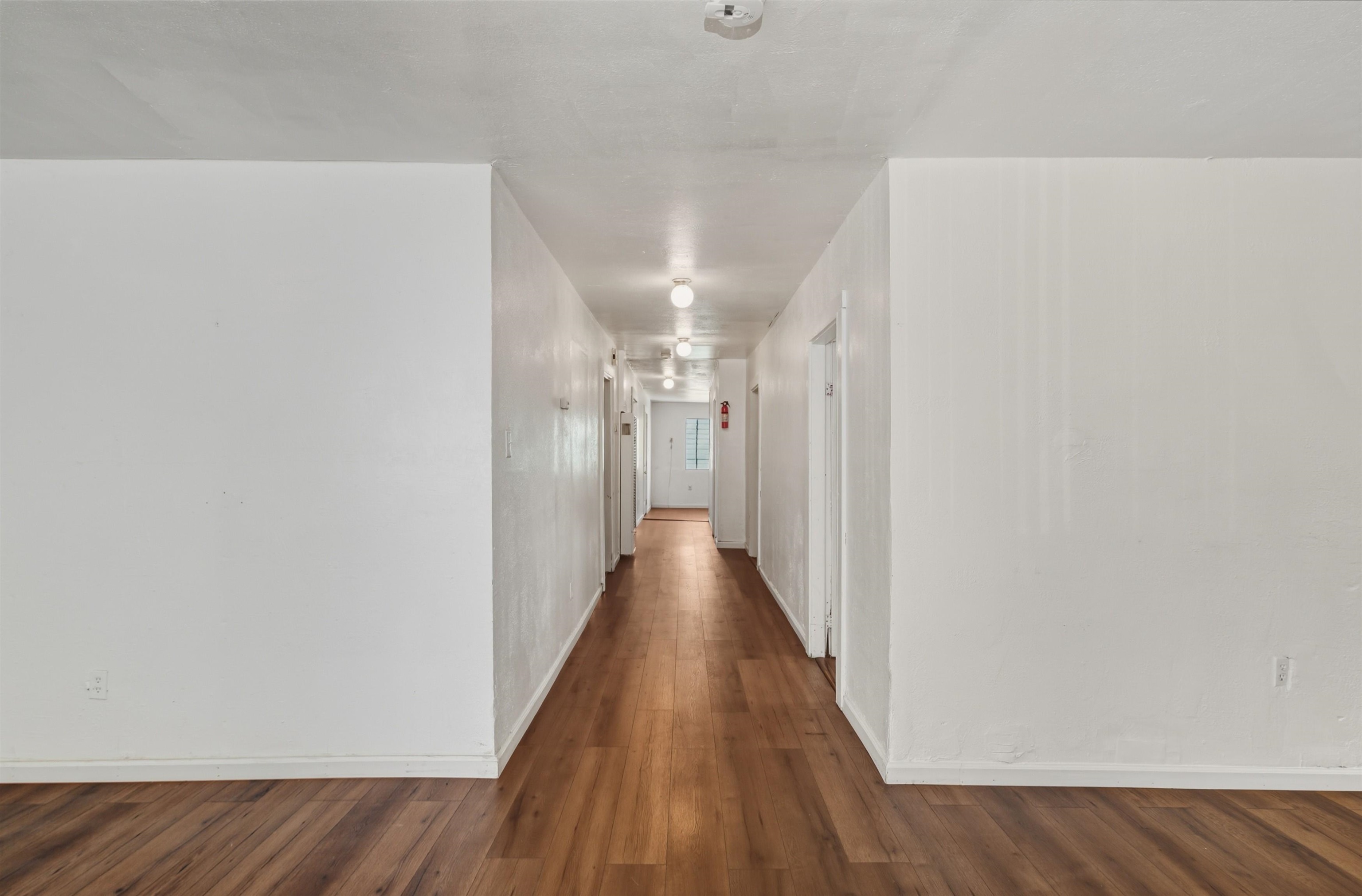 1111 Campbell Street Oakland, CA 94607 - Photo 5 of 17 a view of a hallway with wooden floor