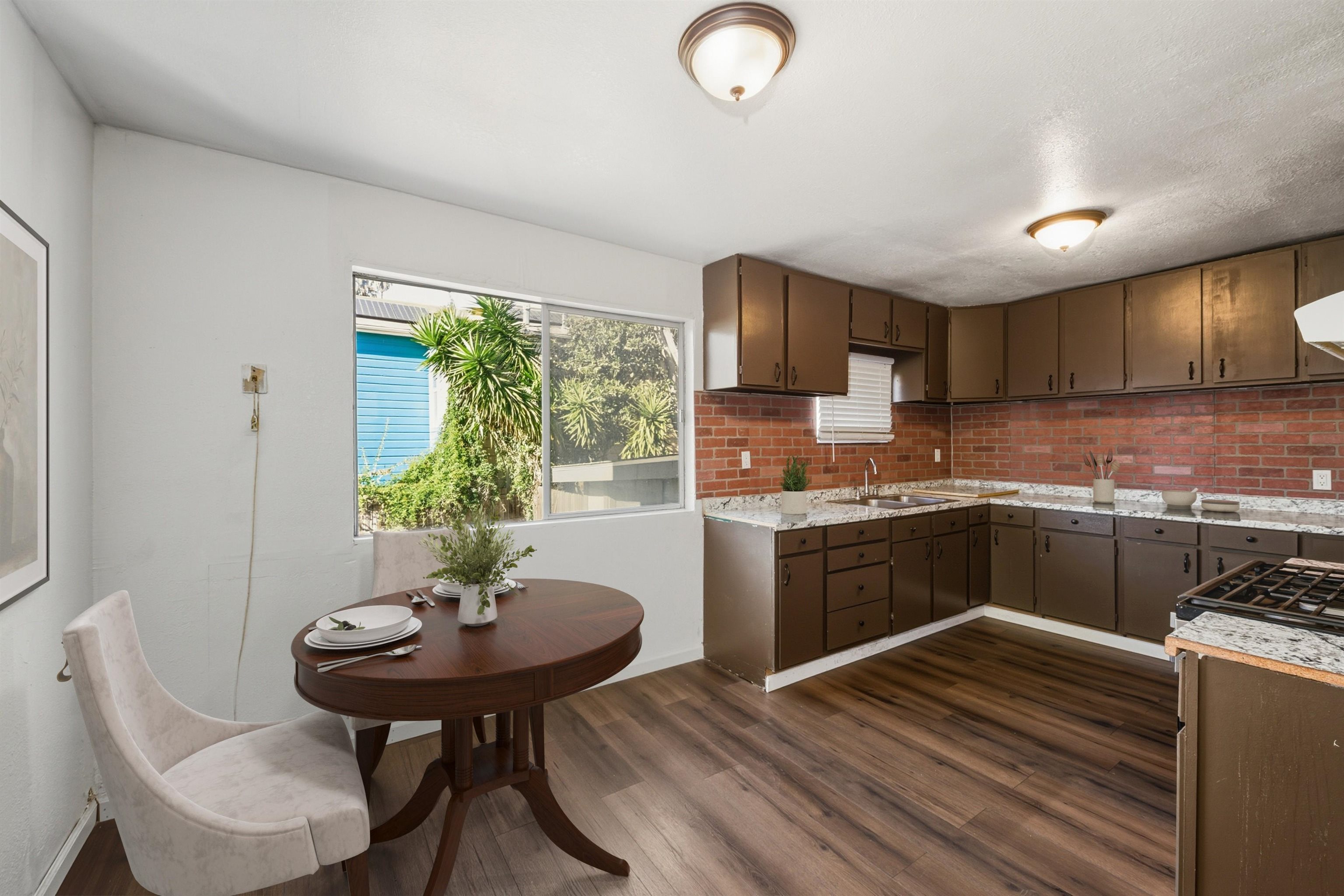 1111 Campbell Street Oakland, CA 94607 - Photo 7 of 17 a kitchen with a sink cabinets and window