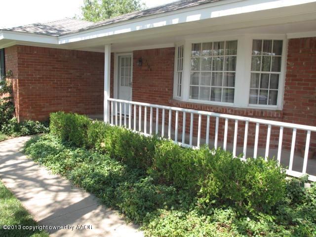 7106 Elmhurst Road Amarillo, TX 79106 - Photo 2 of 10 a view of a house with a backyard